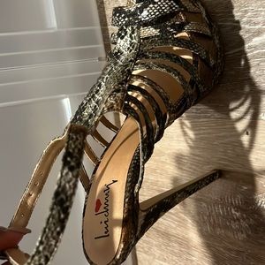Brand new snake skin stilettos heels size 8.